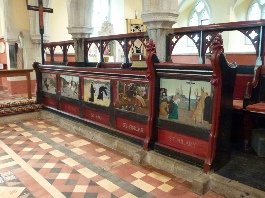 Painted pews in St Hilary.